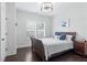 Cozy bedroom features plantation shutters and dark wood floors at 1442 Pierce Se Ave, Smyrna, GA 30080