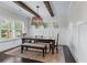 Bright dining room featuring a wooden table, dark hardwood floors, and neutral decor at 1442 Pierce Se Ave, Smyrna, GA 30080