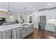 Open concept kitchen with stainless steel appliances and large farmhouse sink at 1442 Pierce Se Ave, Smyrna, GA 30080