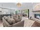 Open-concept living room with access to the kitchen and outdoor patio at 1442 Pierce Se Ave, Smyrna, GA 30080
