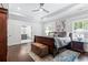 Large primary bedroom features tray ceilings and an ensuite bathroom at 1442 Pierce Se Ave, Smyrna, GA 30080