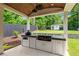 Outdoor kitchen featuring a built-in grill, sink, and storage at 1442 Pierce Se Ave, Smyrna, GA 30080