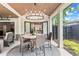 Covered patio featuring an outdoor dining area and a beautiful landscaped yard at 1442 Pierce Se Ave, Smyrna, GA 30080