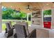 Covered patio features outdoor seating, an outdoor fireplace, and a ceiling fan at 1442 Pierce Se Ave, Smyrna, GA 30080