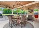 Inviting covered patio features a dining area and an outdoor kitchen at 1442 Pierce Se Ave, Smyrna, GA 30080