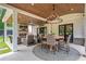 Inviting covered outdoor living area with seating and a wood-burning fireplace at 1442 Pierce Se Ave, Smyrna, GA 30080
