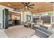 Spacious covered patio with an outdoor living area and a peek into the kitchen at 1442 Pierce Se Ave, Smyrna, GA 30080