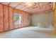 Unfinished basement with insulated walls, exposed framing, and concrete floor at 3198 Garden Hill Ln, Douglasville, GA 30135