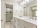 Bright bathroom with double vanity, marble countertops, and tiled shower at 3198 Garden Hill Ln, Douglasville, GA 30135