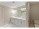 Bathroom with double vanity, ample lighting, and a toilet at 3198 Garden Hill Ln, Douglasville, GA 30135
