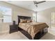 This bedroom has a ceiling fan and large bed that has built in drawers at the base at 3198 Garden Hill Ln, Douglasville, GA 30135