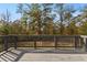 Spacious deck with wooden railings overlooking trees at 3198 Garden Hill Ln, Douglasville, GA 30135