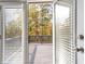 A deck seen through an open glass door offers an expansive view at 3198 Garden Hill Ln, Douglasville, GA 30135