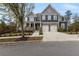 Charming two-story home with stone accents, well manicured yard, and inviting front porch at 3198 Garden Hill Ln, Douglasville, GA 30135