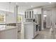 A modern kitchen with stainless steel appliances and an island with granite countertops at 3198 Garden Hill Ln, Douglasville, GA 30135