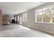 Spacious living room with windows, a ceiling fan, and a partial view of furniture at 3198 Garden Hill Ln, Douglasville, GA 30135