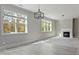 A bright living room has two windows and a fireplace at 3198 Garden Hill Ln, Douglasville, GA 30135