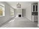 A bright living room has two windows and a fireplace at 3198 Garden Hill Ln, Douglasville, GA 30135