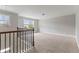 Upstairs loft area provides extra living space with neutral paint and new carpet at 3198 Garden Hill Ln, Douglasville, GA 30135