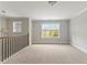 Upstairs loft area provides extra living space with neutral paint and new carpet at 3198 Garden Hill Ln, Douglasville, GA 30135