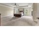 Spacious main bedroom with tray ceiling, cozy fireplace, and lots of natural light at 3198 Garden Hill Ln, Douglasville, GA 30135