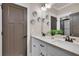 Bathroom with double sinks, quartz countertop, framed mirror, and decorative accents at 35 Cornish Creek Ln, Covington, GA 30014
