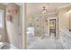 Bathroom features a large glass shower, soaking tub and marble floors at 35 Cornish Creek Ln, Covington, GA 30014