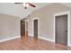 Spacious bedroom showcasing hardwood floors, neutral walls, and elegant trim work around the doors at 35 Cornish Creek Ln, Covington, GA 30014
