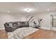 Finished bonus room with comfortable seating and exercise equipment at 35 Cornish Creek Ln, Covington, GA 30014