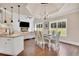 Open dining room with view into the kitchen and living room at 35 Cornish Creek Ln, Covington, GA 30014