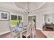 Dining room features hardwood floors, lots of natural light and a modern chandelier at 35 Cornish Creek Ln, Covington, GA 30014