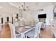 Open dining room with view into the kitchen and living room at 35 Cornish Creek Ln, Covington, GA 30014