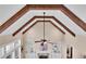 Cozy living room with wood beams, fireplace, built-in bookshelves and large windows at 35 Cornish Creek Ln, Covington, GA 30014