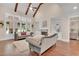 Bright living room featuring a fireplace, built-in shelving, hardwood floors, and comfortable sofas at 35 Cornish Creek Ln, Covington, GA 30014