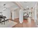 Spacious living area with hardwood floors, columns, grand piano, and ample natural light at 35 Cornish Creek Ln, Covington, GA 30014