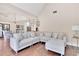 Open concept living room and kitchen with hardwood flooring, neutral colors and recessed lighting at 35 Cornish Creek Ln, Covington, GA 30014