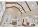 Bright and airy living room with high ceilings, wood beams, fireplace, and hardwood floors at 35 Cornish Creek Ln, Covington, GA 30014