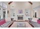 Cozy living room with fireplace, built-in bookshelves, hardwood floors, and comfortable sofas at 35 Cornish Creek Ln, Covington, GA 30014