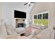 Bright living room features fireplace, hardwood floors, neutral paint and furniture and natural light at 35 Cornish Creek Ln, Covington, GA 30014