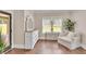 Sitting area in main bedroom features hardwood floors and lots of natural light at 35 Cornish Creek Ln, Covington, GA 30014