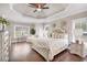 Spacious bedroom features decorative tray ceiling, lots of natural light and warm paint colors at 35 Cornish Creek Ln, Covington, GA 30014