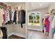 Spacious walk-in closet with closet system and lots of natural light at 35 Cornish Creek Ln, Covington, GA 30014