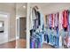 Walk-in closet with mirror and closet system at 35 Cornish Creek Ln, Covington, GA 30014