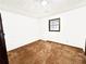 Cozy bedroom with carpet flooring, one window allowing natural light, and painted block walls at 102 Bascomb Drive Dr, Woodstock, GA 30189
