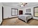 Spacious bedroom with ample natural light, ceiling fan, and room for a large bed and furnishings at 102 Bascomb Drive Dr, Woodstock, GA 30189