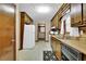 Efficient kitchen layout with wood cabinets, white appliances, and plenty of storage space at 102 Bascomb Drive Dr, Woodstock, GA 30189