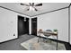 Office space with modern desk and chair, complemented by neutral carpet and two doors at 102 Bascomb Drive Dr, Woodstock, GA 30189