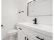 Modern bathroom featuring a white vanity, black fixtures, and glass shower enclosure at 2702 Galaxy Ct, Decatur, GA 30034