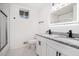 Updated bathroom featuring double sinks, modern lighting, and granite counters at 2702 Galaxy Ct, Decatur, GA 30034