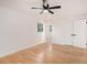 Sunny bedroom featuring hardwood floors, neutral paint, and a ceiling fan at 2702 Galaxy Ct, Decatur, GA 30034